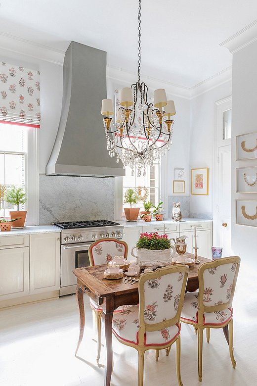 French farmhouse style incorporates elegant details, such as cabriole legs on a distressed wood table. Photo courtesy of Julie Neill.
